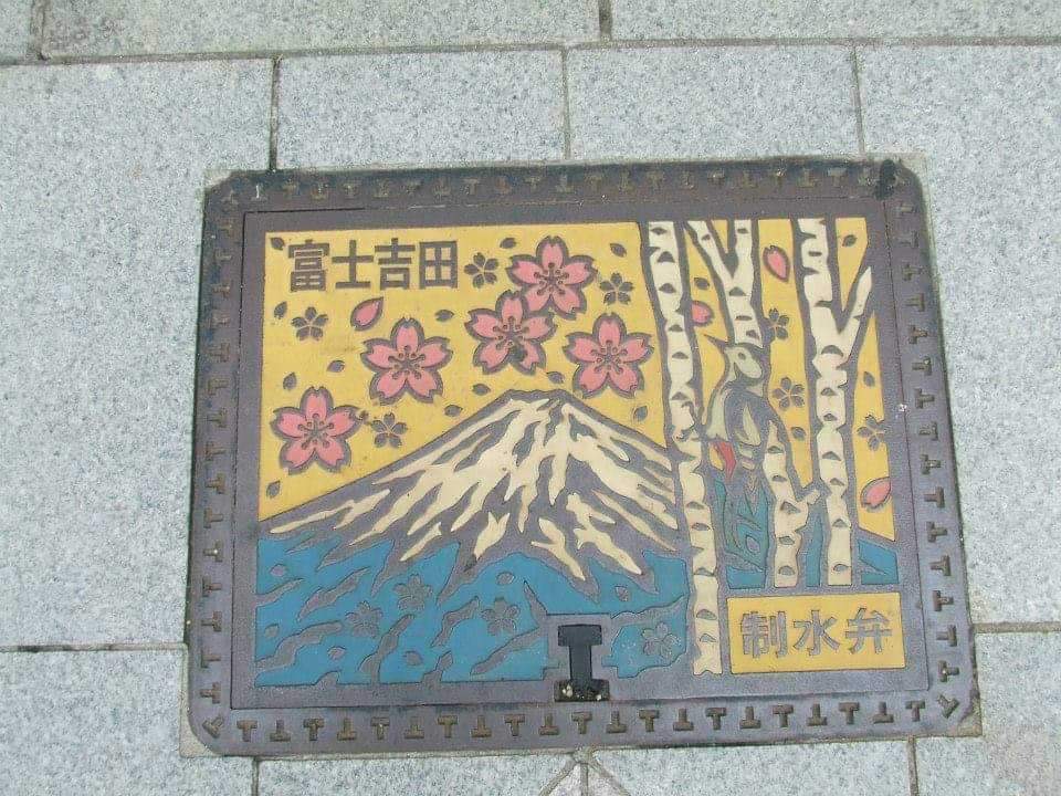 A decorative pipe cap near Mt. Fuji